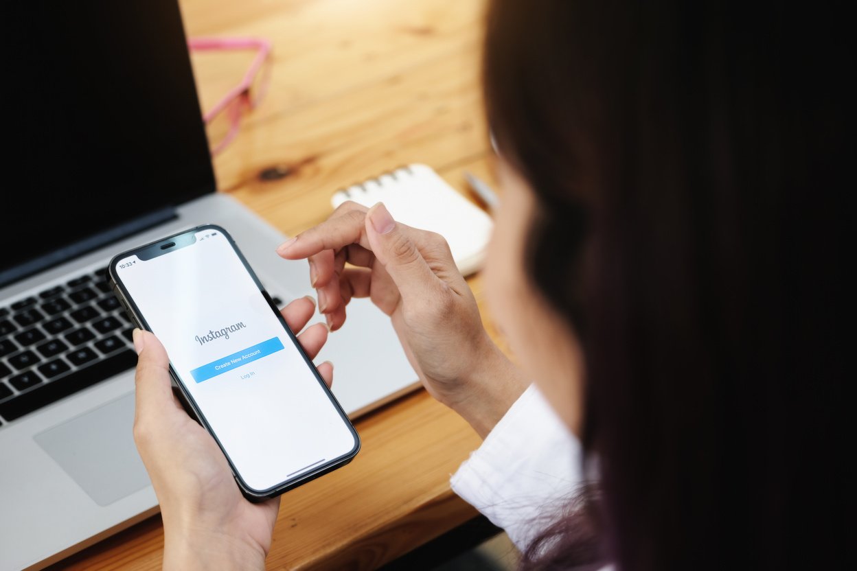 CHIANGMAI, THAILAND - MAY 30, 2021: a Woman Holding Smartphone with Instagram Application on the Screen. Instagram Is a Photo Sharing App for Smartphones.